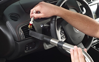 Close Up Of Person Cleaning Car Interior