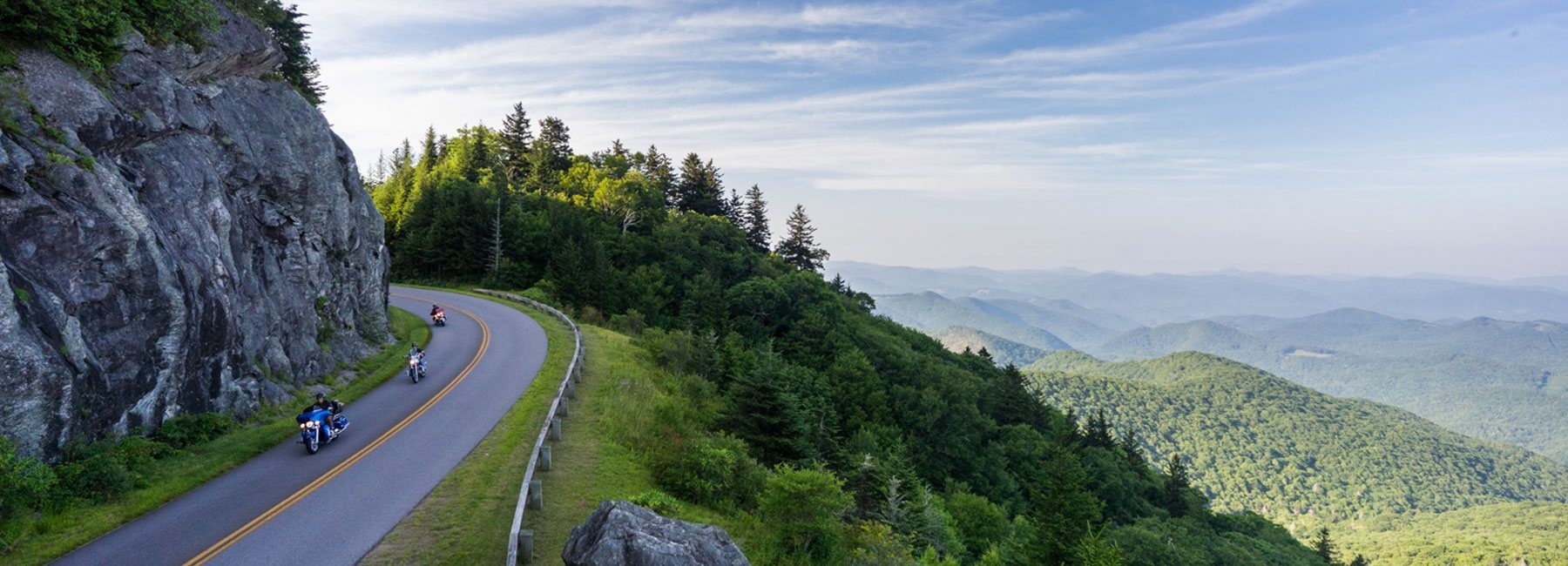 Motorcycles Driving On Mountain Road