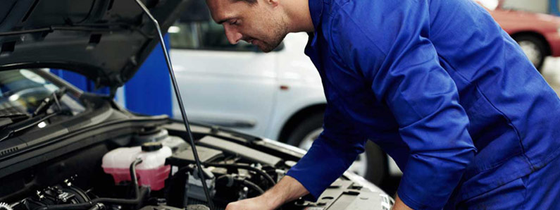 mechanic working on a car