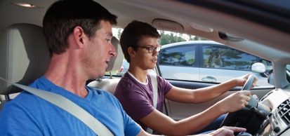 Student Driver And Instructor In Car