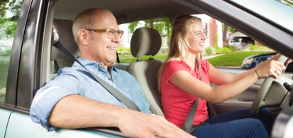 Student Driver And Instructor In Car