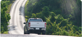 Wide Shot Of Pick Up Truck Driving